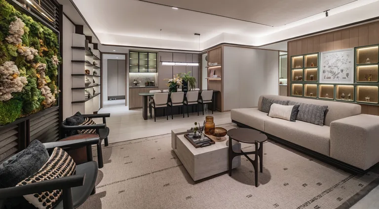 Bloomsbury Residences, artist&rsquo;s impression: a living and dining room in warm stone and timber, with a green wall, a long sofa and a dining table by the kitchen